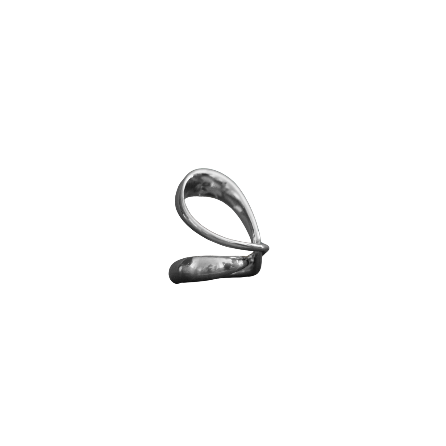 A small metallic silver object with a looped, abstract shape, centered on a plain white background.
